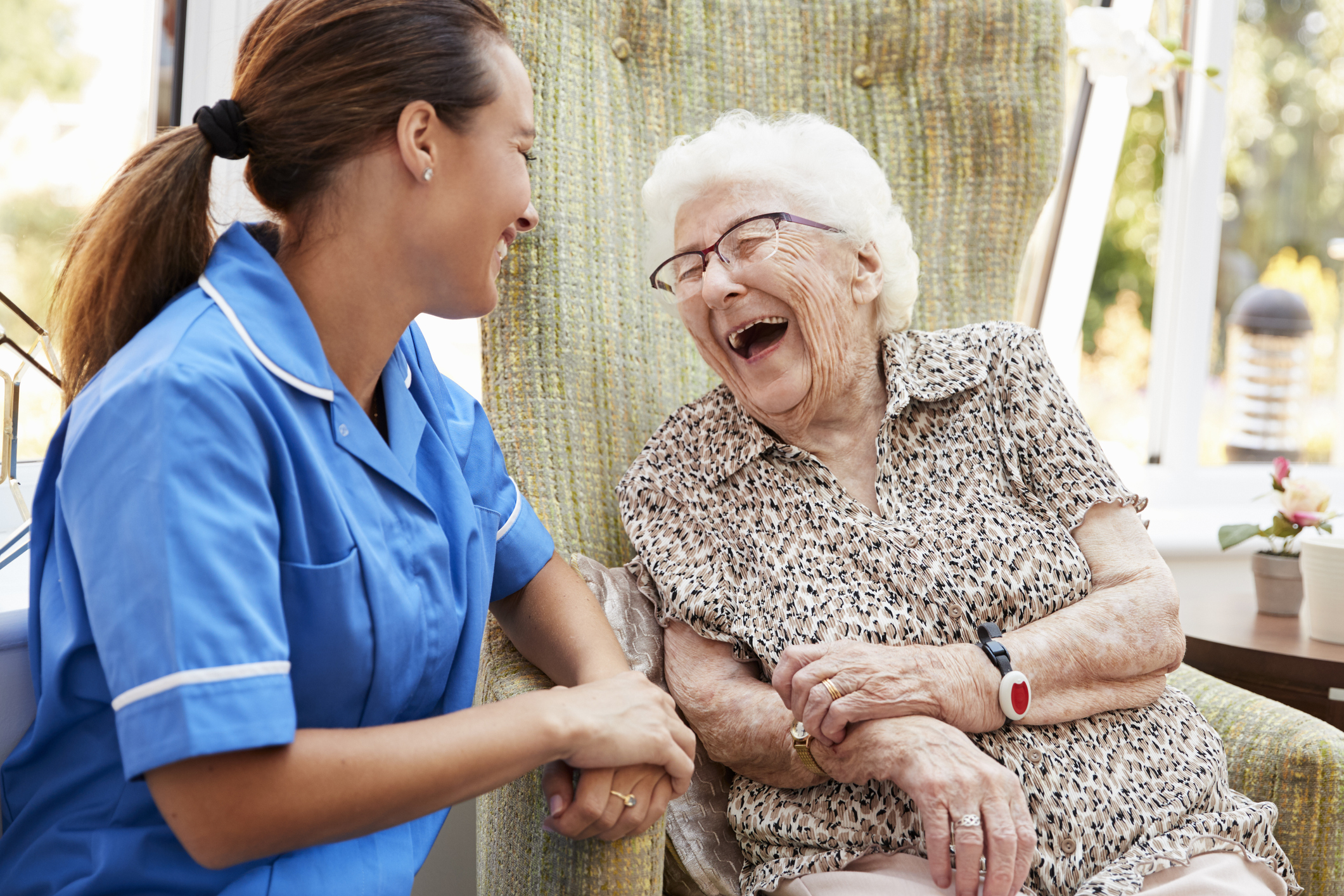 care worker reading with resident